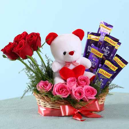 Send roses chocolate n teddy basket arrangement online